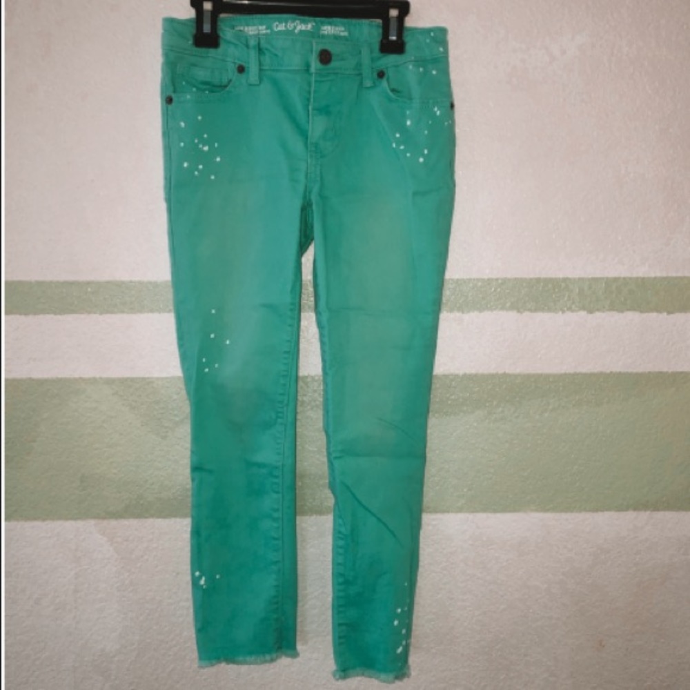 Teal jeans with white dots